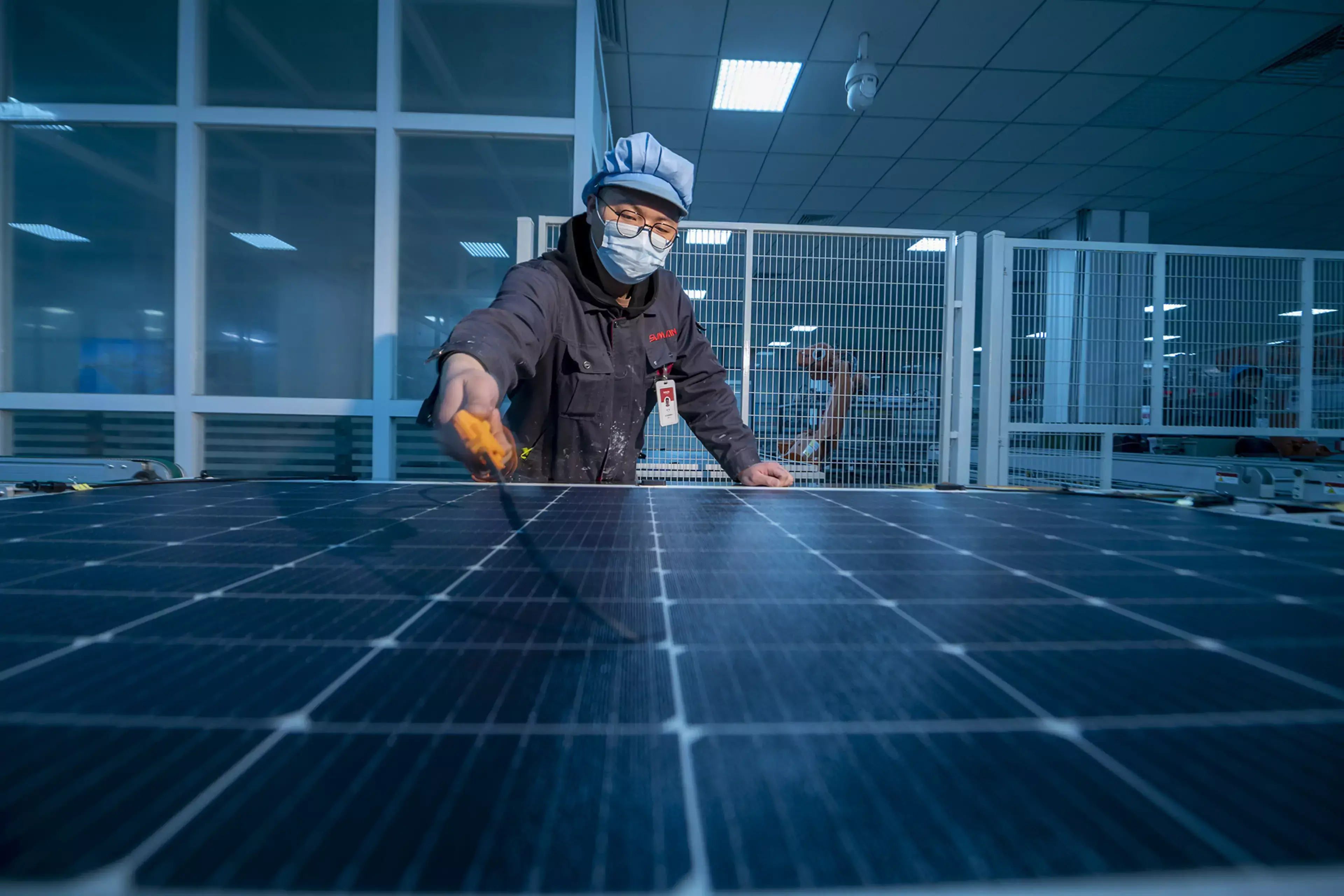 A technician works on a solar panel production line in Yangzhong, China.