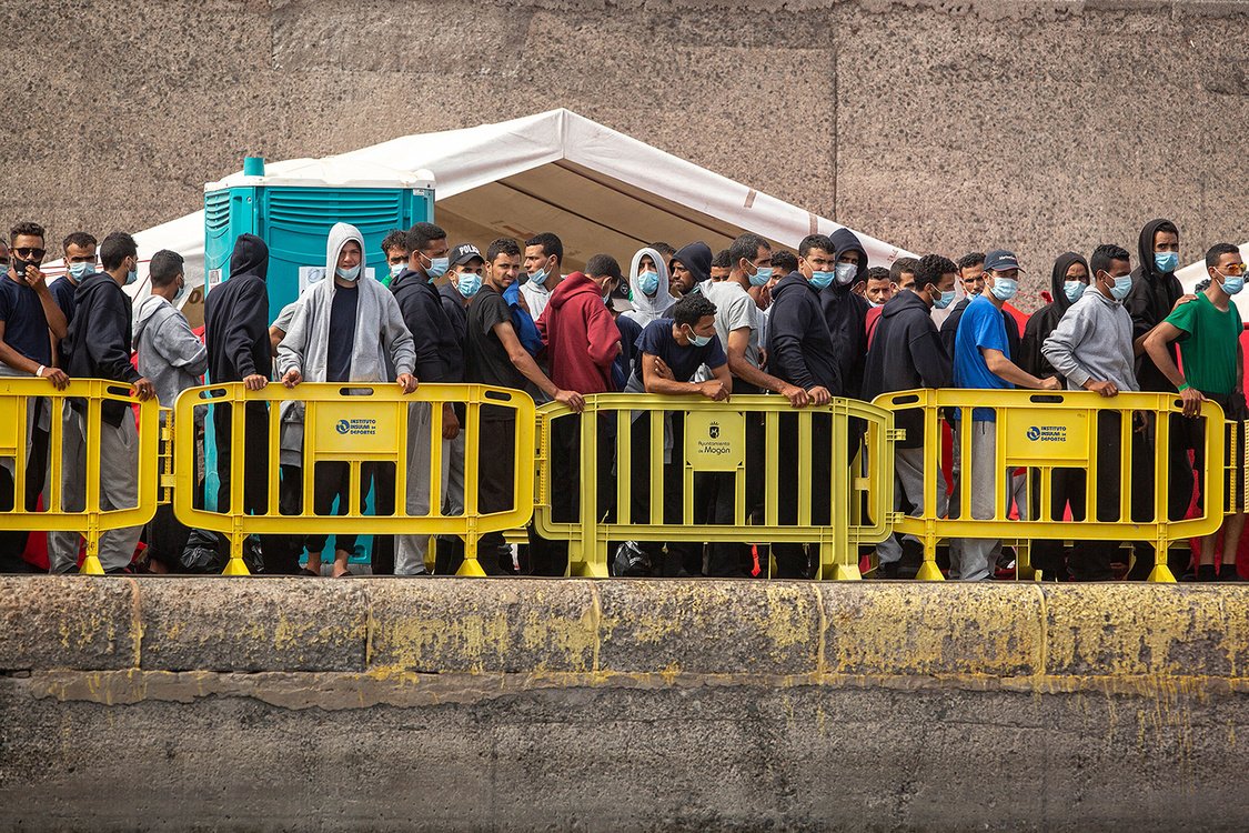 Migrants from a group of 1300 rescued from different boats remain in the port of Arguineguin while being cared for by the Spanish Red Cross and the National Police on the Spanish Canary island of Gran Canaria