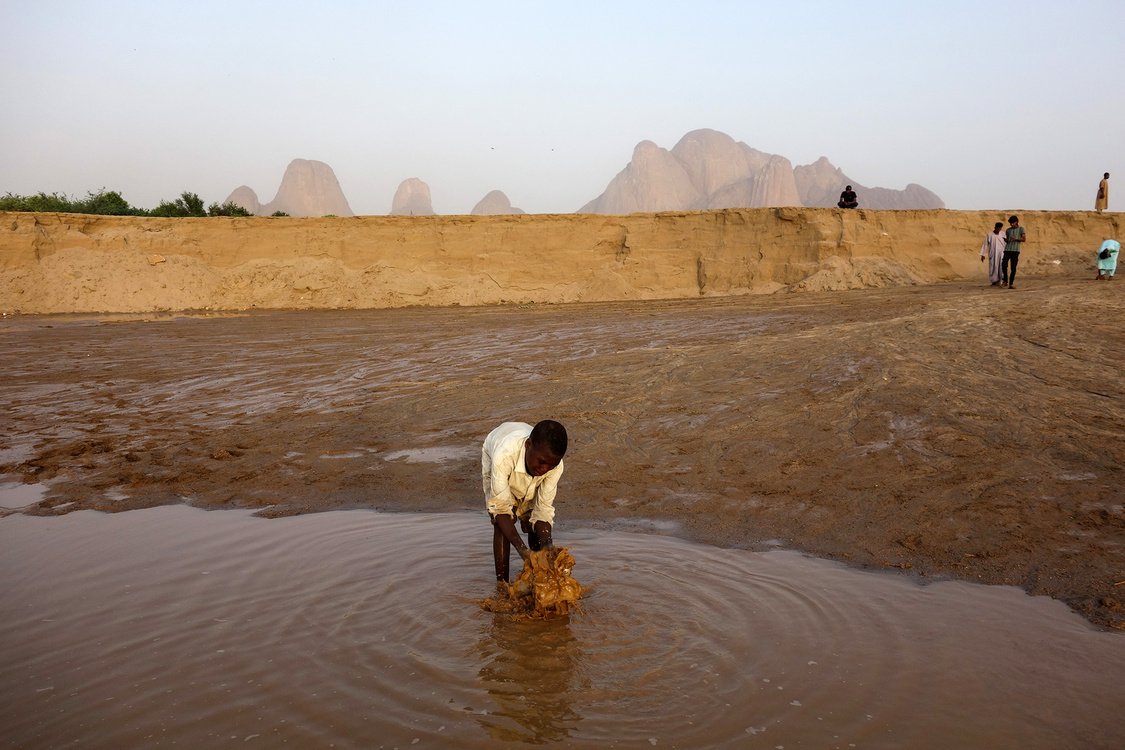 A child splashes water in the Gash River, Sudan.