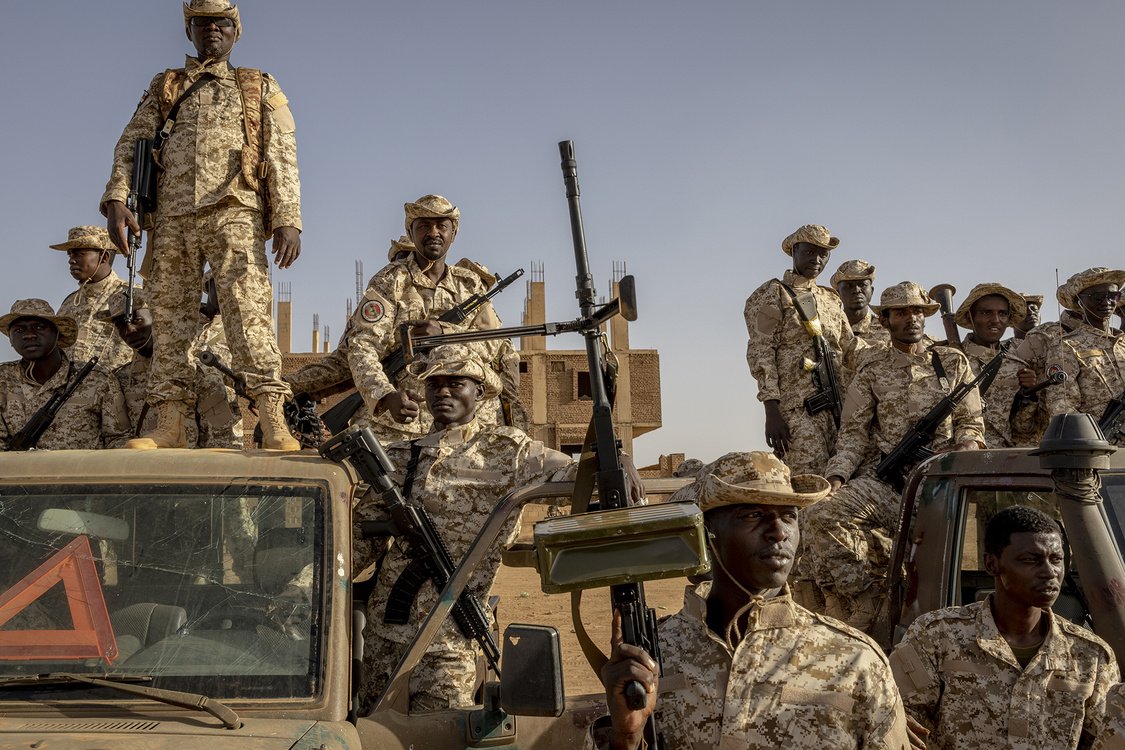 Members of a Sudanese special forces unit posing with weapons during a military demonstration in Omdurman, outside Khartoum