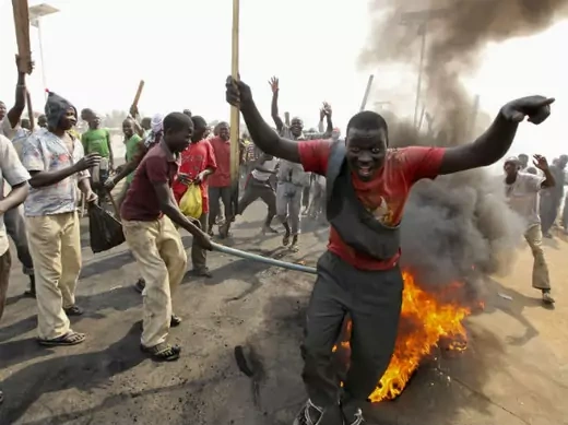 Demonstrators gather at a burning barricade during a protest against the elimination of a popular fuel subsidy that has doubled the price of petrol, at Gwagwalada on the outskirts of Nigeria's capital Abuja January 9, 2012