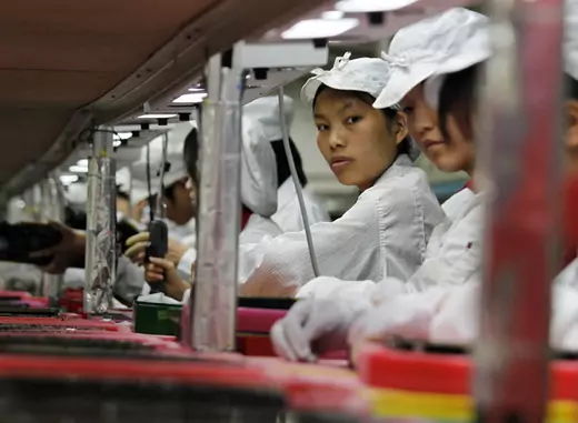Workers are seen inside a Foxconn factory in the southern Guangdong province of China (Bobby Yip/Courtesy Reuters).
