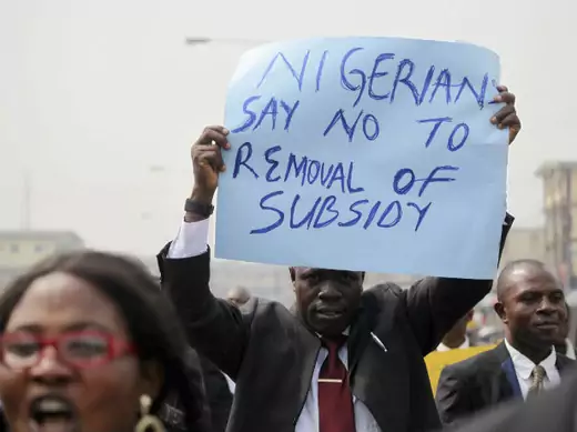 A member of the Nigerian Bar Association holds up a placard to protest a fuel subsidy removal in Lagos January 5, 2012. 