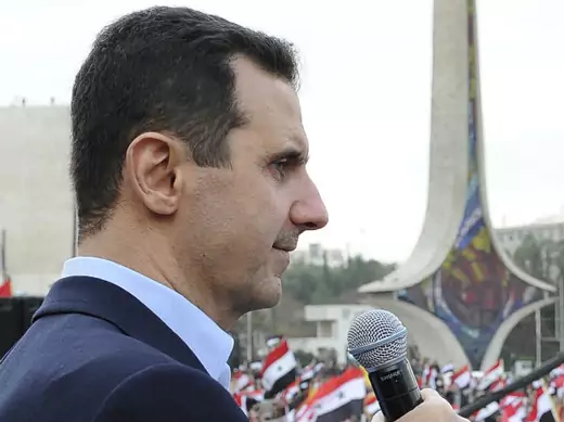 Syria's president Bashar al-Assad addresses his supporters during a surprise appearance at a rally in Umayyad Square in Damascus on January 11, 2012 (Wael Hmedan/Courtesy Reuters).