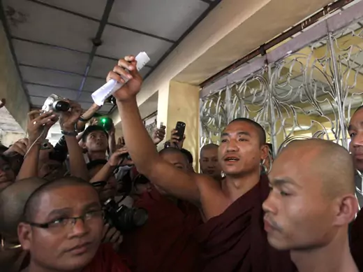 Shin Gambira (center), leader of the All-Burmese Monks Alliance, talks to supporters in January, 2012, after his release from prison. BBC News reported Friday that he has been once again taken away by Burmese authorities. 