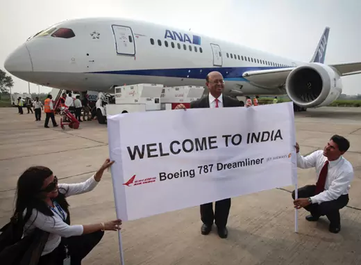 The president of Boeing India poses in front of the Boeing 787 Dreamliner aircraft for All Nippon Airways (ANA) after its India debut landing in New Delhi in July 2011 (B Mathur/Courtesy Reuters).