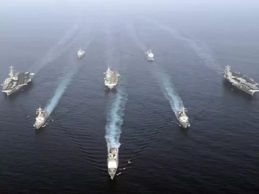 U.S. warships carrying 17,000 personnel enter the Gulf in a show of force off Iran's coast. (U.S. Fifth Fleet handout/courtesy Reuters) 