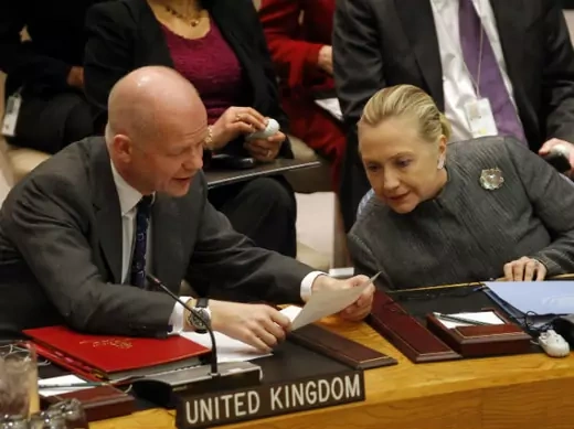 U.S. secretary of state Hillary Clinton confers with British foreign minister William Hague before a UN Security Council meeting at the United Nations in New York on January 31, 2012 (Mike Segar/Courtesy Reuters).