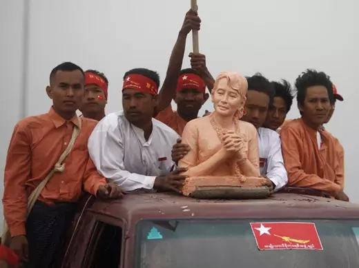 Supporters carry a bust of Myanmar pro-democracy leader Aung San Suu Kyi as she arrives in Mandalay March 3, 2012.