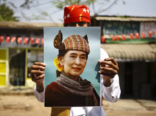 A supporter holds up a portrait of Myanmar pro-democracy leader Aung San Suu Kyi during an election campaign of the National League for Democracy (NLD) party in Yangon March 28, 2012.