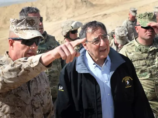 Defense Secretary Leon Panetta is greeted by Col. John Shafer (L) after arriving to greet troops at Forward Operating Base Shukvani, Afghanistan on March 14, 2012. (Scott Olson/Courtesy Reuters) 