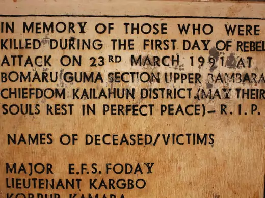 A sign commemorating the start of the civil war is displayed at a memorial site where the conflict began, in the village of Bomaru, eastern Sierra Leone April 22, 2012. 