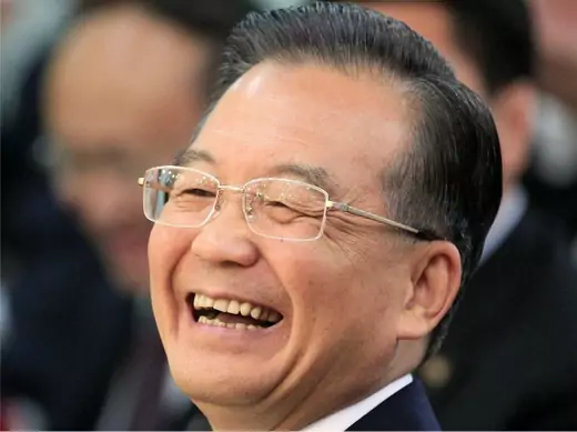 Chinese Premier Wen Jiabao smiles as he watches a performance given by students during his visit to the Chinese Culture Center in Seoul May 29, 2010.