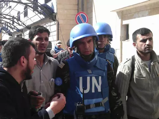 Members of the first U.N. monitoring team in Syria, together with members of the Syrian Free Army, visit Homs on April 21, 2012.