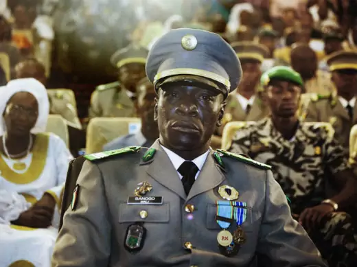 Coup leader Captain Amadou Sanogo attends a ceremony as former parliament speaker Dioncounda Traore (unseen) is sworn in as Mali's interim president in the captial Bamako, April 12, 2012.
