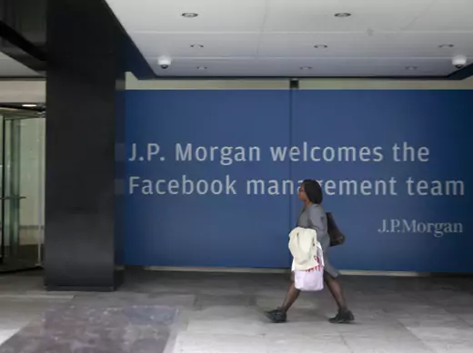 A woman walking near a J.P. Morgan sign welcoming Facebook's management team in preparation of its IPO. (Lee Celano/Courtesy Reuters)