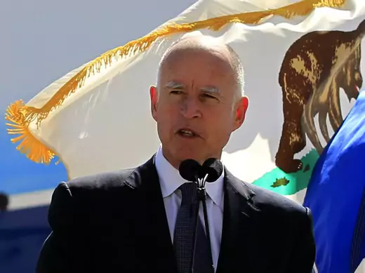 California Governor Jerry Brown speaks in front of a California flag in Long Beach, California on March 14, 2012. (Lucy Nicholson/Courtesy Reuters)