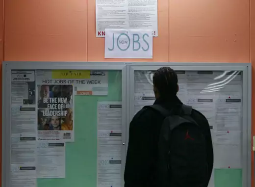 A man looks at employment opportunities in San Francisco (Robert Galbraith/Courtesy Reuters).
