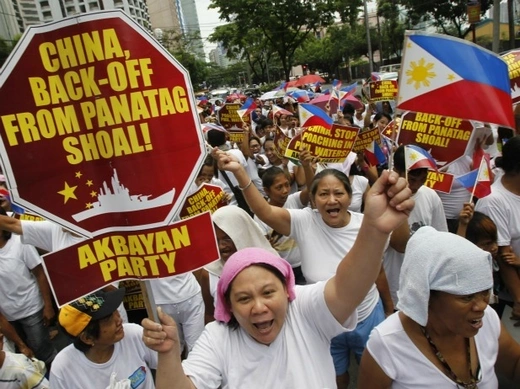 Filipinos chant anti-China slogans as they march towards the Chinese consulate in Manila's Makati financial district on May 11, 2012.