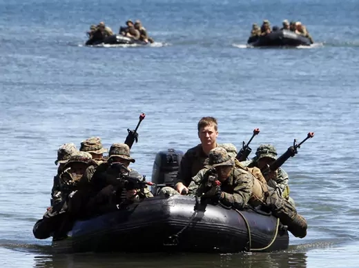 Philippine and U.S. marines sit in rubber dinghies during an amphibious raid as part of a Philippine-U.S. joint military exercise in Ulugan bay