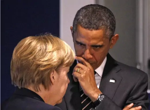  Germany's Chancellor Merkel and U.S. President Obama discuss before a meeting on the second day of the G20 Summit in Cannes