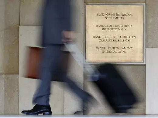 A man enters the headquarters of the Bank for International Settlements, which sponsors the international Basel Committee on Banking Supervision that issued the Basel III rules (Christian Hartmann/Courtesy Reuters). 