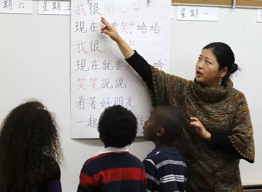 Teacher Kennis Wong points to Chinese characters on a board at Broadway Elementary School in Los Angeles, California (Lucy Nicholson/Courtesy Reuters).