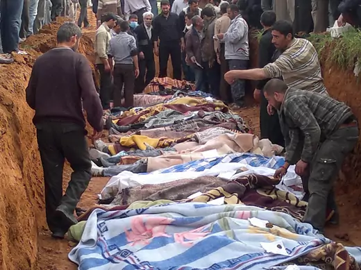 People carry the body of men, whom activists say were killed by the Syrian government army, in Taftanaz village, east of Idlib city April 5, 2012. Picture taken April 5, 2012. (Shaam News/Courtesy Reuters) 