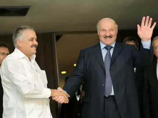 Belarussian president Alexander Lukashenko shakes hands with Cuban vice minister of foreign affairs Dagoberto Rodriguez at Havana's Jose Marti airport on June 24, 2012 (Enrique de la Osa/Courtesy Reuters).