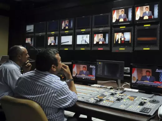 President-elect Mohamed Morsi is seen on screens at the Egyptian Television headquarters control room during his first televised address to the nation in Cairo on June 24, 2012 (Courtesy Reuters). 