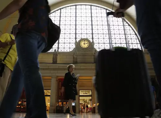 Travelers walk through Union Station in Washington (Jonathan Ernst/Courtesy Reuters).