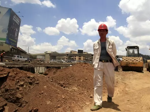 A Chinese contractor walks at the site of the Nairobi-Thika highway project, under construction near Kenya's capital Nairobi, on September 23, 2011.