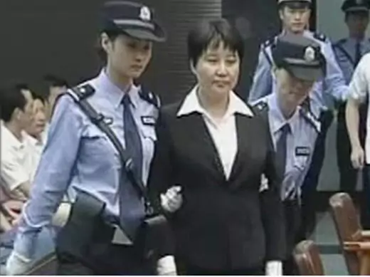 Gu Kailai, wife of ousted Chinese Communist Party Politburo member Bo Xilai, attends a trial in the court room at Hefei Intermediate People's Court in this still image taken from video