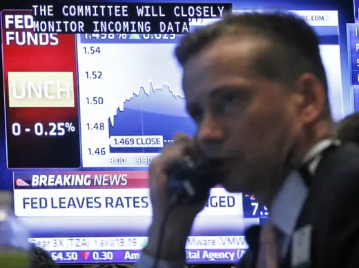 Traders on the floor of the New York Stock Exchange react to the latest interest rate decision of the Federal Reserve (Brendan McDermid/Courtesy Reuters).