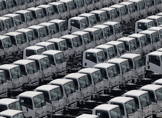 Newly produced trucks are seen at an industrial port before they are loaded onto a cargo ship in Yokohama, Japan (Kim Kyung-Hoon/Courtesy Reuters). 