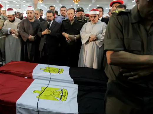 Egypt's prime minister Hisham Kandil prays for soldiers killed during an attack at a checkpoint along the Sinai border with Israel by unknown gunmen, at Omar Makram mosque in Cairo on August 7, 2012 (Mohamed Abd El Ghany/Courtesy Reuters).