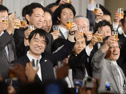 Osaka Mayor Toru Hashimoto toasts with members of his new Japan Restoration Party at a fund-raising party in this photo taken by Kyodo in Osaka