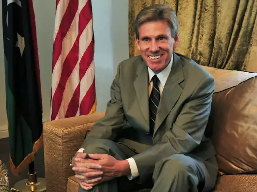 Christopher Stevens, the U.S. ambassador to Libya, smiles at his home in Tripoli on June 28, 2012 (Al-Fetori/Courtesy Reuters).