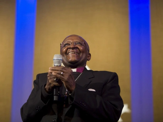 Archbishop Desmond Tutu, Chairman of The Elders, listens to Aung San Suu Kyi, General Secretary of the National League for Democracy who was speaking over a monitor from Myanmar, during a discussion regarding humanitarian leadership at the Clinton Global Initiative in New York, September 21, 2011.
