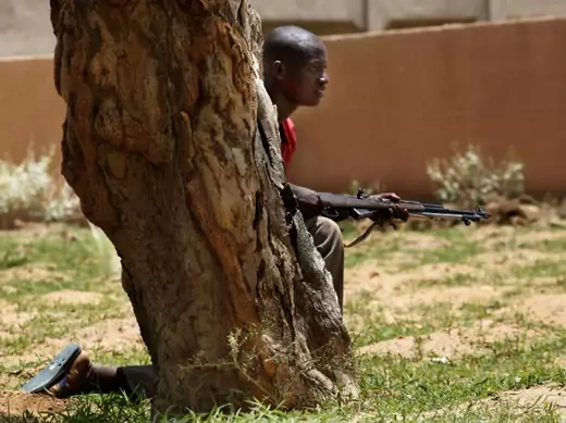 A member of a self-defense militia trains northeast of the capital Bamako 20/07/2012.