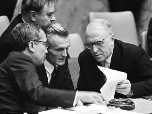 Acting UN secretary general U Thant and Soviet ambassador to the UN Valerian A. Zorin discuss a document through an interpreter at the UN Security Council on October 24, 1962. (UN Photo/Yutaka Nagata)