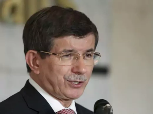 Turkish foreign minister Ahmet Davutoglu speaks with reporters during a news conference (al-Sayaghi/Courtesy Reuters).