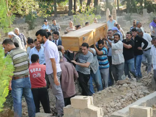 Relatives carry the coffin of a victim during a funeral procession at a cemetery in the border town of Akcakale on October 4, 2012 (Stringer/Courtesy Reuters).