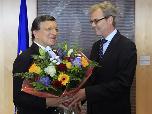 European Commission President Barroso receives flowers from Leikvoll, Norway's Ambassador to the European Union, at the EC headquarters in Brussels