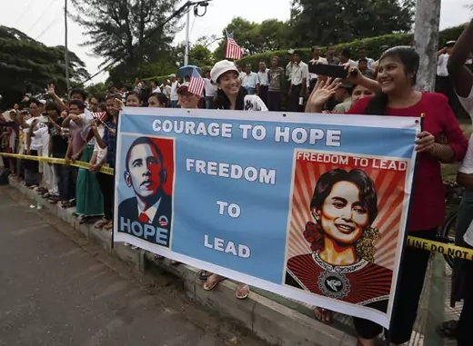 Crowds line a street outside the home of Myanmar's opposition leader Aung San Suu Kyi as U.S. president Barack Obama arrives to meet her in Yangon November 19, 2012.