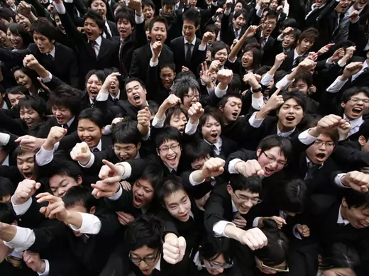 Japanese college students raise their fists at a job-hunting rally in Tokyo February 5, 2009 (Toru Hanai/Courtesy Reuters).