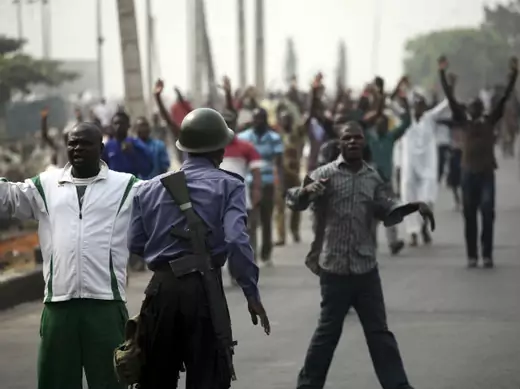  A soldier guards a road during an operation to disperse people protesting against the removal of fuel subsidies in Lagos 16/01/2012.