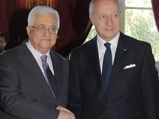 France's Foreign Affairs Minister Fabius greets Palestinian President Mahmoud Abbas  before a meeting in Paris