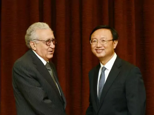 U.N.-Arab League peace envoy for Syria Lakhdar Brahimi shakes hands with Chinese Foreign Minister Yang Jiechi before their meeting at the Ministry of Foreign Affairs in Beijing on October 31, 2012.