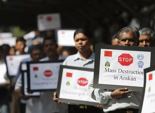 Myanmar people of Rohingya ethnicity who are living in Malaysia, display placards during a rally outside Malaysia's Foreign Ministry in Putrajaya.